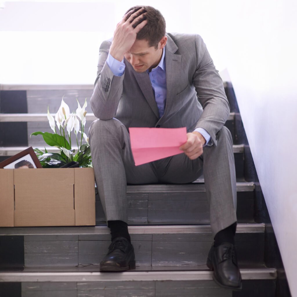 shot-of-a-despondent-businessman-holding-a-pink-sl-2025-04-06-12-40-32-utc